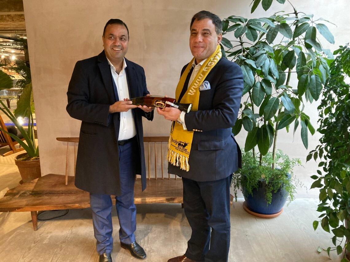 kul-acharya-with-lord-bilimoria-handshake