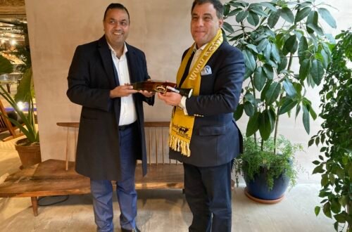 kul-acharya-with-lord-bilimoria-handshake